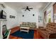 Charming living room with colorful accents, featuring a comfortable sofa, recliner, and decorative fireplace at 457 8Th N Ave, St Petersburg, FL 33701