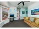 Inviting living room with eclectic decor, featuring a comfortable sofa, natural light, and an attached table at 457 8Th N Ave, St Petersburg, FL 33701