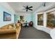 Comfortable living room with a ceiling fan, a bay window, a sofa and cozy seating, perfect for relaxation at 457 8Th N Ave, St Petersburg, FL 33701