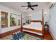 Bedroom featuring hardwood floors, natural light, and a four-poster bed at 457 8Th N Ave, St Petersburg, FL 33701