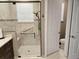Bathroom showcasing a walk-in shower with glass door and white tile at 4830 Grand Banks Dr, Wimauma, FL 33598