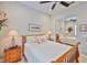 Comfortable bedroom featuring a mirrored closet and warm wooden furniture at 4830 Grand Banks Dr, Wimauma, FL 33598