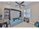 Versatile room featuring a sleek Murphy bed and custom shelving for flexible living at 4830 Grand Banks Dr, Wimauma, FL 33598