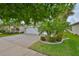 Charming home featuring a brick-paved driveway, well-manicured landscaping, and a two-car garage at 4830 Grand Banks Dr, Wimauma, FL 33598