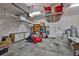 Spacious garage with overhead storage racks at 4830 Grand Banks Dr, Wimauma, FL 33598
