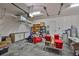 Spacious garage featuring ample storage, overhead racks, and a clean, well-maintained floor at 4830 Grand Banks Dr, Wimauma, FL 33598
