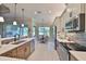 Bright kitchen with stainless steel appliances, light countertops and breakfast nook at 4830 Grand Banks Dr, Wimauma, FL 33598