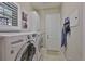 Functional laundry room with modern washer and dryer at 4830 Grand Banks Dr, Wimauma, FL 33598