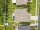 Overhead view of property with fenced yard, patio, shed, and detailed roof showcasing home's structure at 4852 Trinidad Dr, Land O Lakes, FL 34639