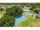 Aerial view of community basketball courts, pool, and clubhouse amenities at 4852 Trinidad Dr, Land O Lakes, FL 34639