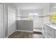 Well-lit bathroom features a glass-enclosed shower and modern vanity with a single sink at 4852 Trinidad Dr, Land O Lakes, FL 34639