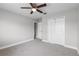 This bedroom features a ceiling fan, closet, and neutral walls with white trim at 4852 Trinidad Dr, Land O Lakes, FL 34639