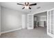 Bedroom features a ceiling fan, closet, neutral walls and carpet at 4852 Trinidad Dr, Land O Lakes, FL 34639