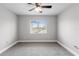 Bright bedroom with a neutral color scheme and a sunlit window at 4852 Trinidad Dr, Land O Lakes, FL 34639