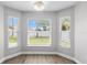 Bright breakfast nook with large windows offering a view of the well-maintained yard at 4852 Trinidad Dr, Land O Lakes, FL 34639
