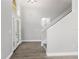 Welcoming foyer featuring a decorative glass front door and staircase leading to the upper level at 4852 Trinidad Dr, Land O Lakes, FL 34639