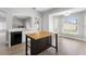 Open-concept kitchen with white cabinets and a butcher block island perfect for entertaining at 4852 Trinidad Dr, Land O Lakes, FL 34639
