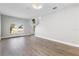 Spacious living room with laminate flooring, natural light, and chandelier lighting at 4852 Trinidad Dr, Land O Lakes, FL 34639
