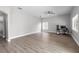 Spacious living room featuring neutral walls, modern ceiling fan and view to backyard at 4852 Trinidad Dr, Land O Lakes, FL 34639