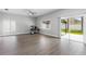 Bright living room with an opening to backyard offering plenty of natural light at 4852 Trinidad Dr, Land O Lakes, FL 34639