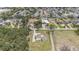 Aerial view showcasing the home's location, large lot, and access to canals in a quiet neighborhood at 5012 Troydale Rd, Tampa, FL 33615
