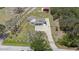 Expansive property featuring a home with a long patterned stone driveway and separate garage at 5012 Troydale Rd, Tampa, FL 33615