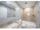 Full bathroom featuring granite counters, a shower/tub combo, and updated fixtures at 5012 Troydale Rd, Tampa, FL 33615