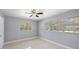 Bright bedroom featuring tile flooring and window views at 5012 Troydale Rd, Tampa, FL 33615