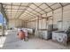 Interior showcasing an expansive shed-like structure with metal girders and partitions at 5012 Troydale Rd, Tampa, FL 33615