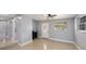 Bright living room with tile floors, a decorative front door, and ample natural light at 5012 Troydale Rd, Tampa, FL 33615
