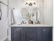 Well-lit bathroom with a double vanity, stylish mirrors, and modern fixtures, creating a luxurious feel at 5301 N Central Ave, Tampa, FL 33603