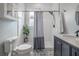 Charming bathroom featuring a subway tiled shower and a vanity with a vessel sink and patterned tile flooring at 5301 N Central Ave, Tampa, FL 33603