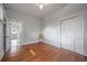Bright bedroom features hardwood floors, a ceiling fan, and a closet for ample storage at 5301 N Central Ave, Tampa, FL 33603