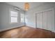 Bedroom with wood floors, a decorative light fixture and an air conditioning unit at 5301 N Central Ave, Tampa, FL 33603