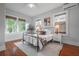 Cozy bedroom with hardwood floors, complemented by natural light and modern décor, creating a relaxing ambiance at 5301 N Central Ave, Tampa, FL 33603