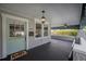 Charming front porch featuring painted accents, a ceiling fan, and an open layout at 5301 N Central Ave, Tampa, FL 33603