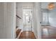 Hallway view of a bathroom with tiled floor, white subway tiles, and a shower at 5301 N Central Ave, Tampa, FL 33603