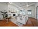 Stylish living room with hardwood floors, white brick fireplace, and comfortable seating at 5301 N Central Ave, Tampa, FL 33603