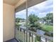 View from screened balcony overlooking a canal with lush greenery at 6334 Spring Flower Dr # 24, New Port Richey, FL 34653