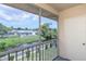 View from the screened balcony of the canal and back of neighboring houses at 6334 Spring Flower Dr # 24, New Port Richey, FL 34653