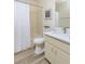 Bathroom with decorative starfish art, vanity, and shower-tub combo at 6334 Spring Flower Dr # 24, New Port Richey, FL 34653