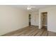 Light-filled bedroom with wood floors, ceiling fan, and access to an ensuite bathroom and closet at 6334 Spring Flower Dr # 24, New Port Richey, FL 34653