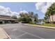 View of community buildings, a pond with fountain, and well-maintained grounds at 6334 Spring Flower Dr # 24, New Port Richey, FL 34653