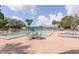 Inviting community pool featuring ample seating, a hot tub, and plenty of room for residents to enjoy at 6334 Spring Flower Dr # 24, New Port Richey, FL 34653