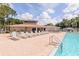 Inviting community pool featuring ample lounge chairs, a hot tub and a convenient clubhouse for residents at 6334 Spring Flower Dr # 24, New Port Richey, FL 34653