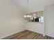 Well-lit dining area with wood floors, features a view into kitchen area, enhancing open concept design at 6334 Spring Flower Dr # 24, New Port Richey, FL 34653