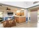 Community center kitchen features a convenient breakfast bar and plenty of counter space for entertaining guests at 6334 Spring Flower Dr # 24, New Port Richey, FL 34653