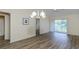Living room with laminate wood floors and sliding glass doors at 6334 Spring Flower Dr # 24, New Port Richey, FL 34653