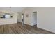 Open concept living area with wood flooring seamlessly connecting living and dining spaces, bright and airy at 6334 Spring Flower Dr # 24, New Port Richey, FL 34653