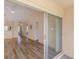 Spacious living room with laminate floors and access to the outside patio at 6334 Spring Flower Dr # 24, New Port Richey, FL 34653